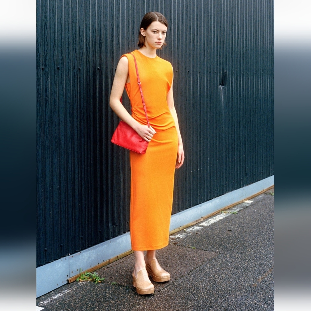 Sidraped orange dress